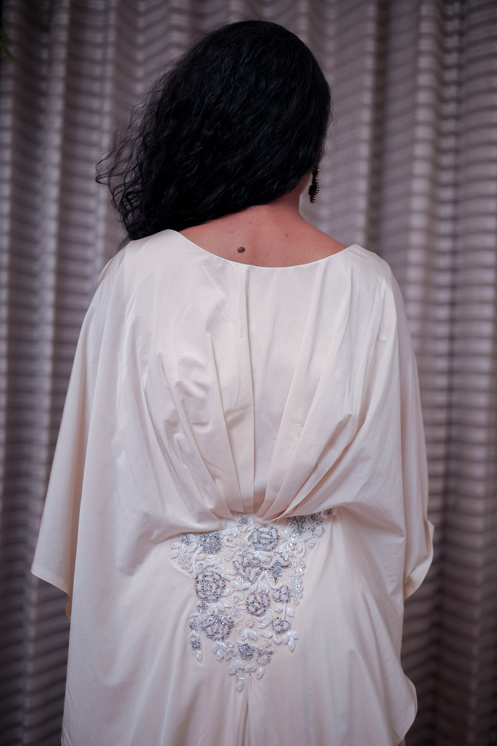 Boho-Chic Elegance: Flowing Cream Gown with Statement Embellishment