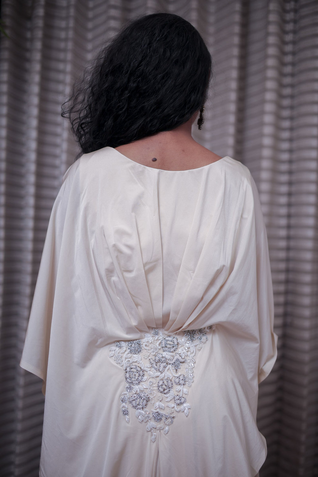 Boho-Chic Elegance: Flowing Cream Gown with Statement Embellishment