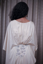 Boho-Chic Elegance: Flowing Cream Gown with Statement Embellishment