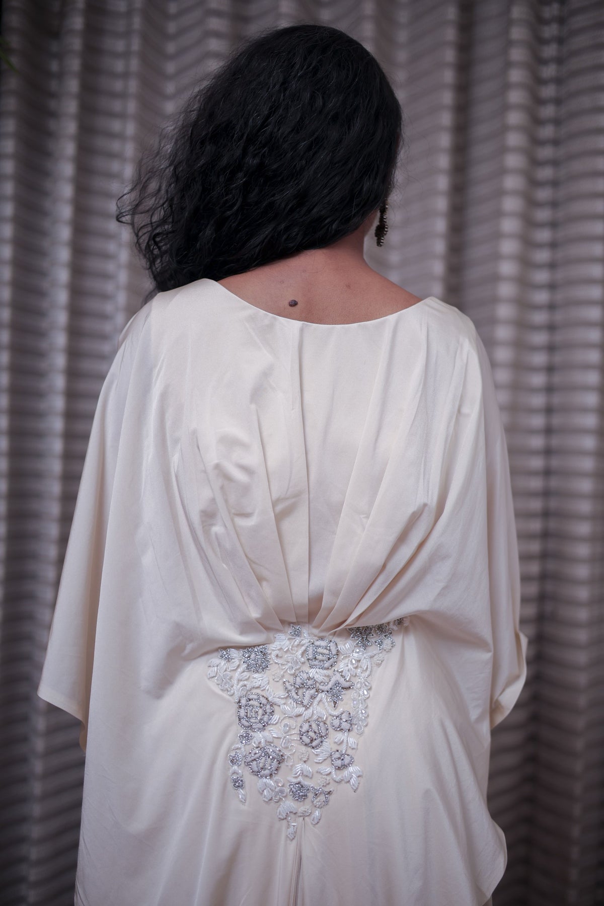 Boho-Chic Elegance: Flowing Cream Gown with Statement Embellishment