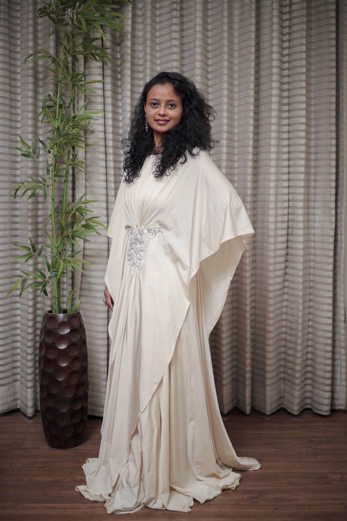 Boho-Chic Elegance: Flowing Cream Gown with Statement Embellishment