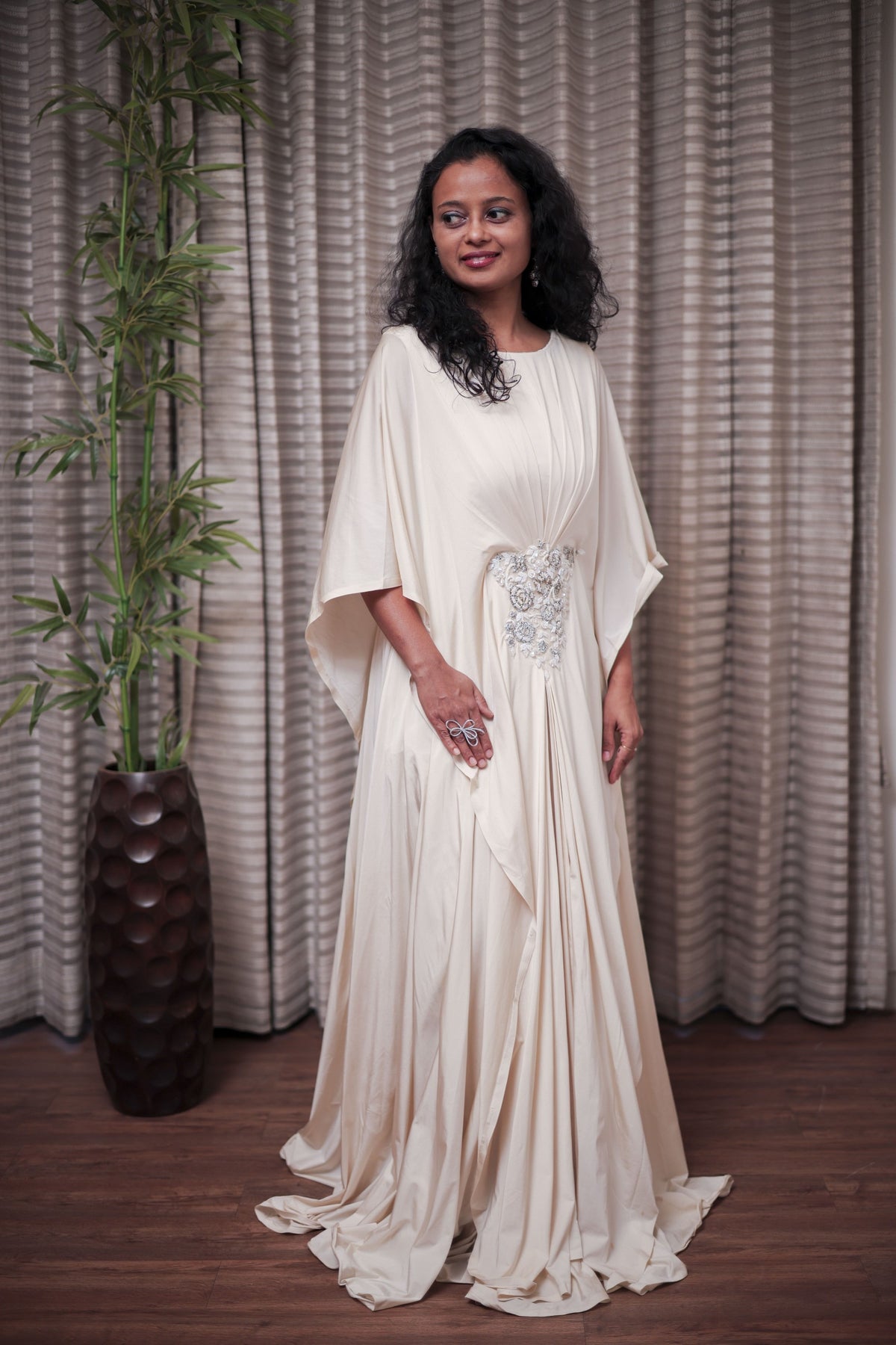 Boho-Chic Elegance: Flowing Cream Gown with Statement Embellishment