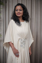Boho-Chic Elegance: Flowing Cream Gown with Statement Embellishment