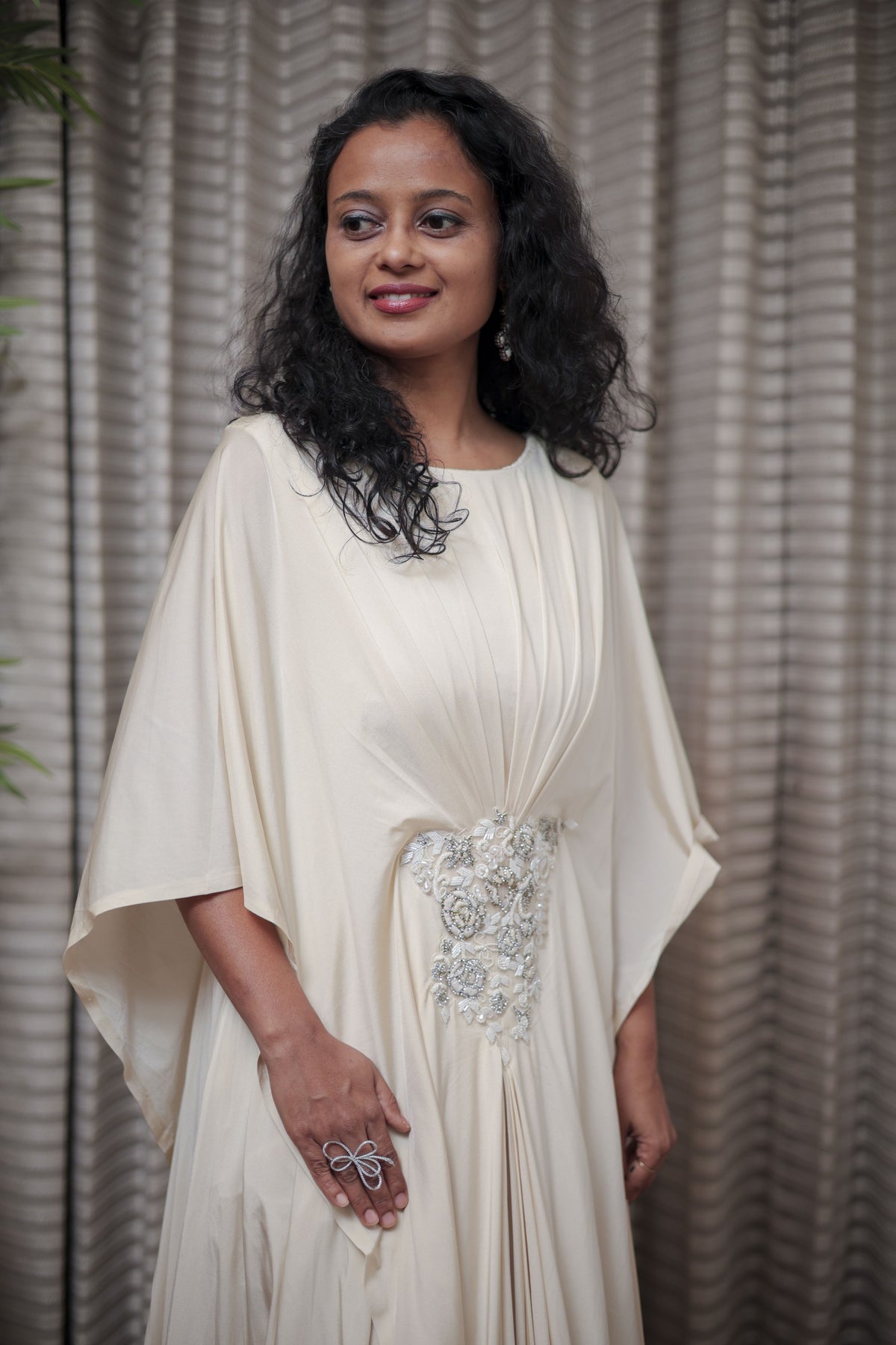 Boho-Chic Elegance: Flowing Cream Gown with Statement Embellishment