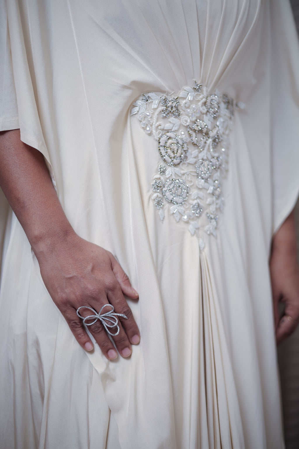 Boho-Chic Elegance: Flowing Cream Gown with Statement Embellishment