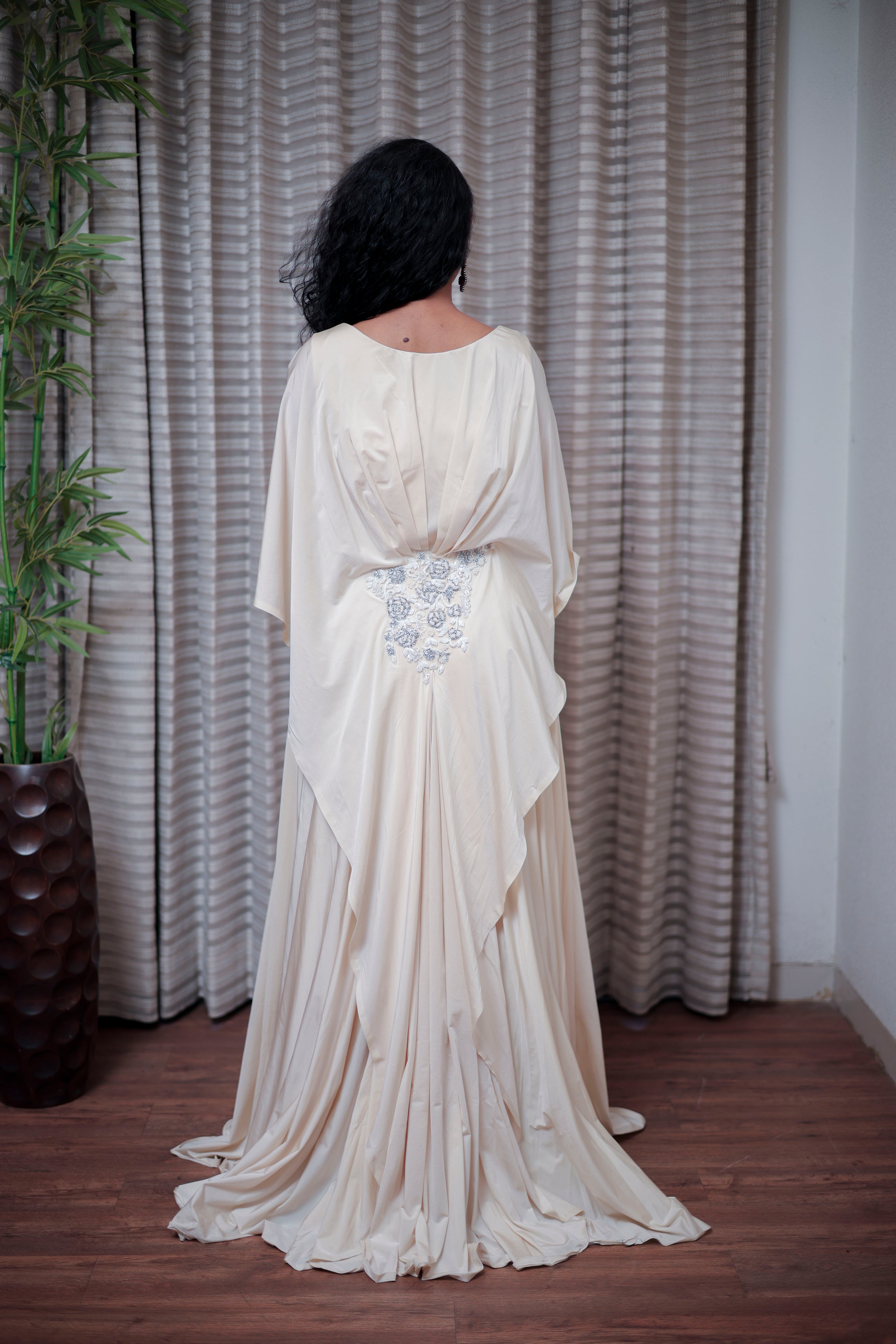 Boho-Chic Elegance: Flowing Cream Gown with Statement Embellishment