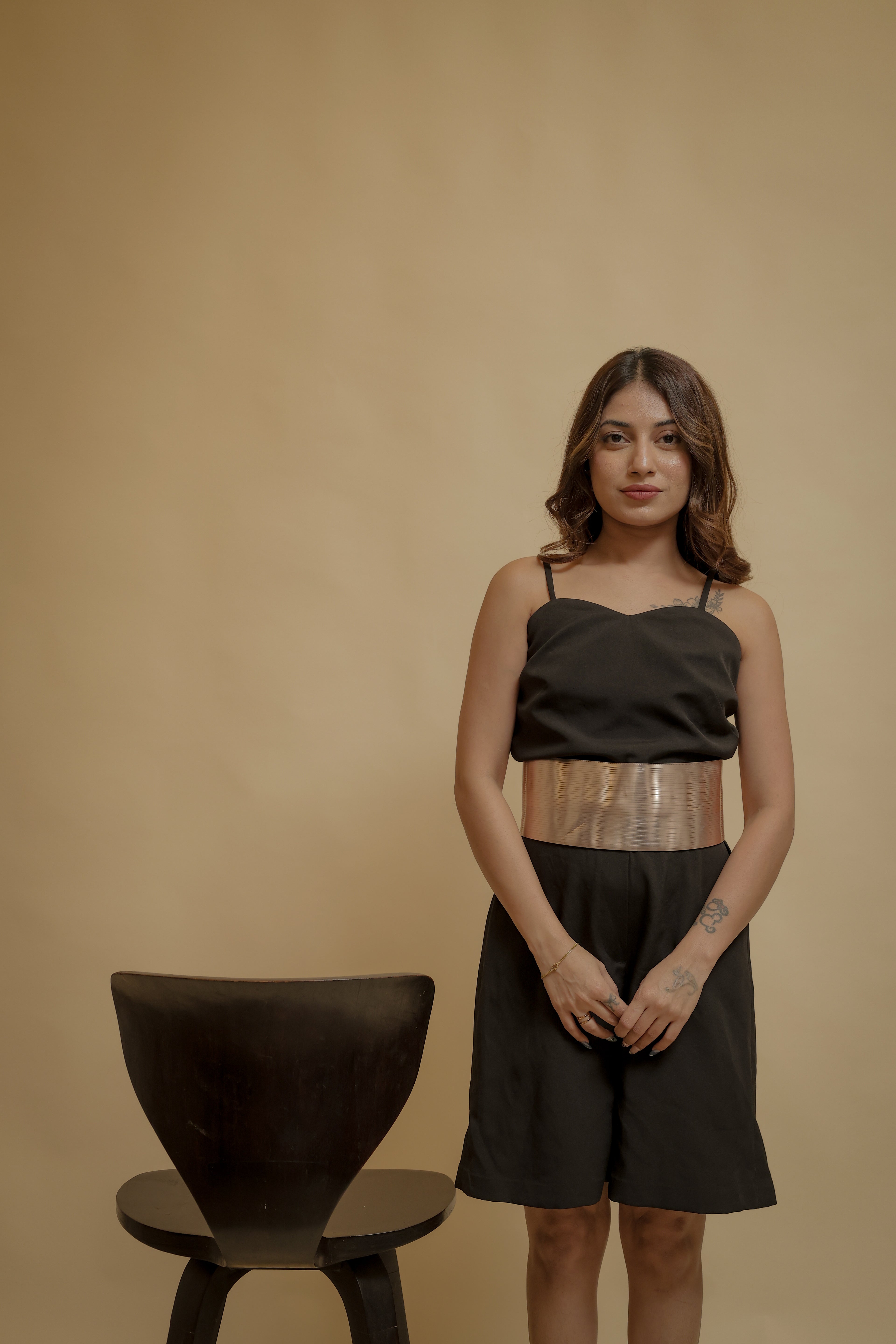 Elegant Black Jumpsuit with Statement Gold Waistband