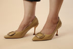 Nude Patent Pointed-Toe Pumps with Gold Buckle